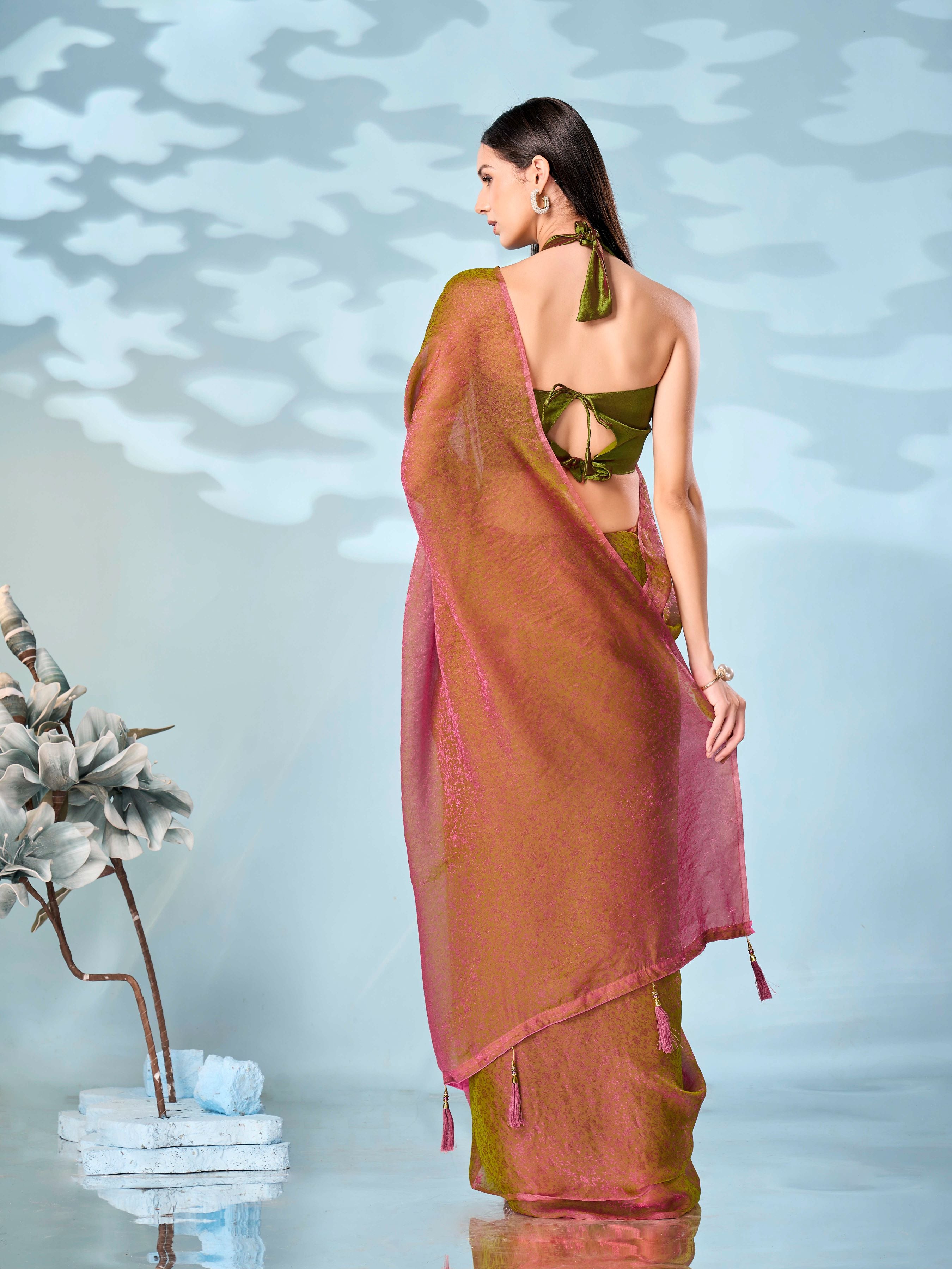 Two tone pink and green colored woven saree with tassles on pallu